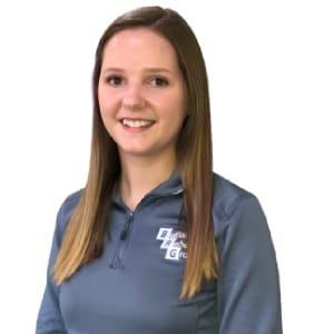 Portrait of a smiling Caucasian woman in a blue sweatshirt
