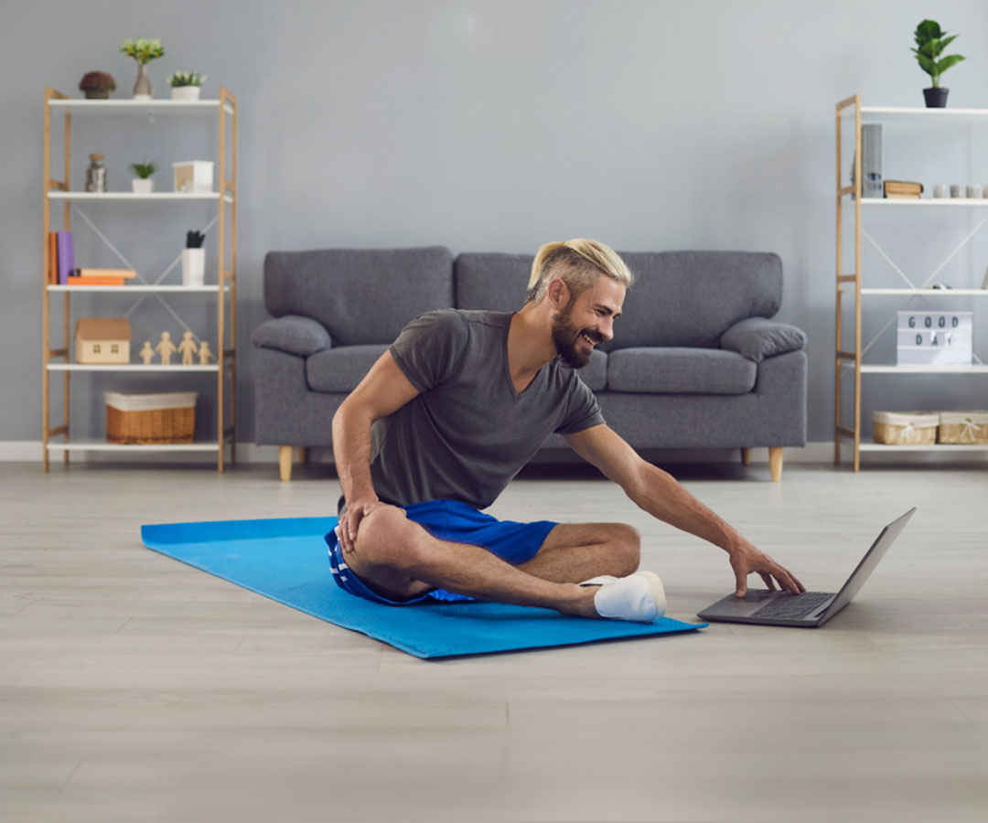 An Occupational Therapist smiles as she treats her patient.